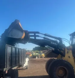Excavator preparing landscape site